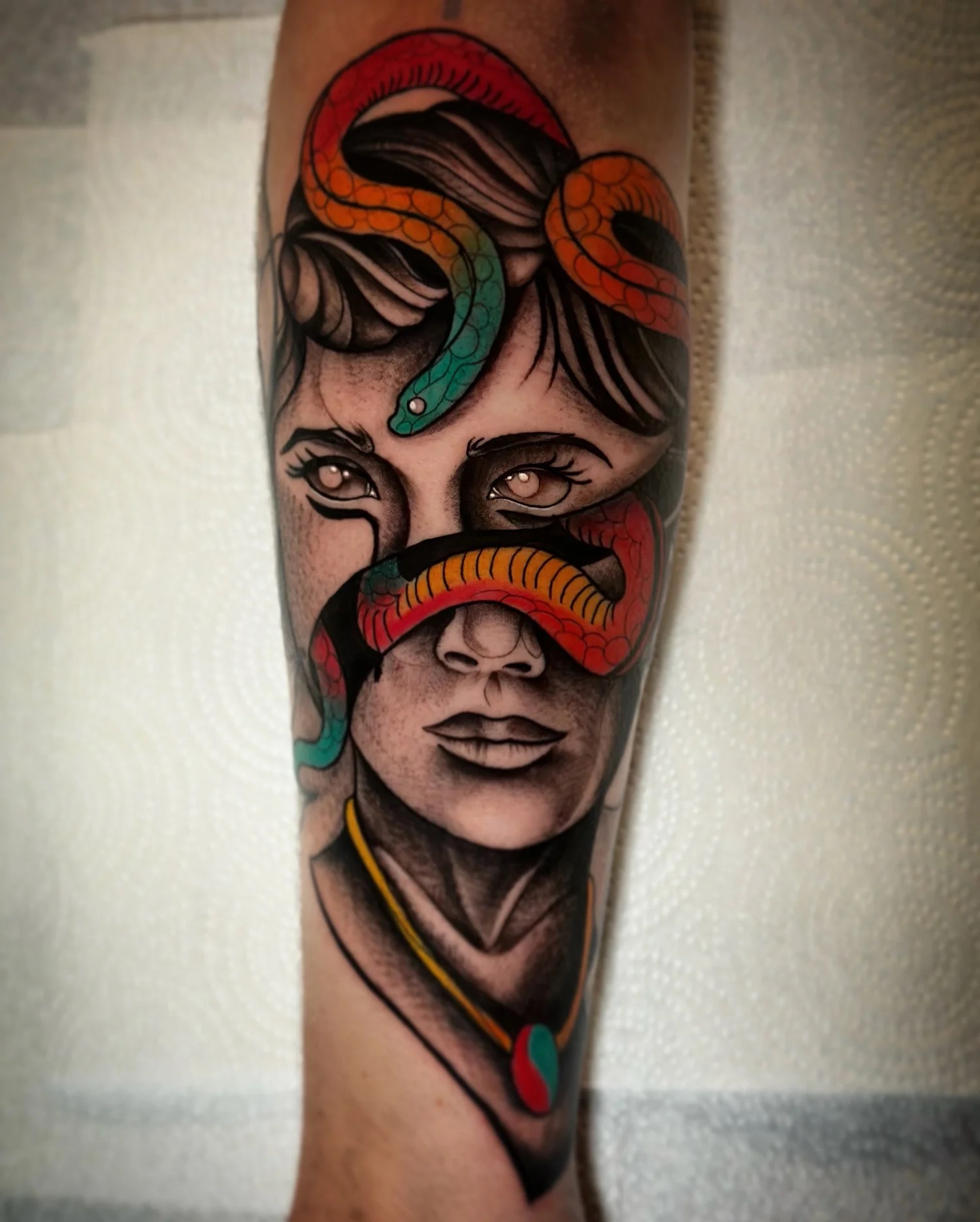 Neotraditional snake-and-portrait tattoo by Tony