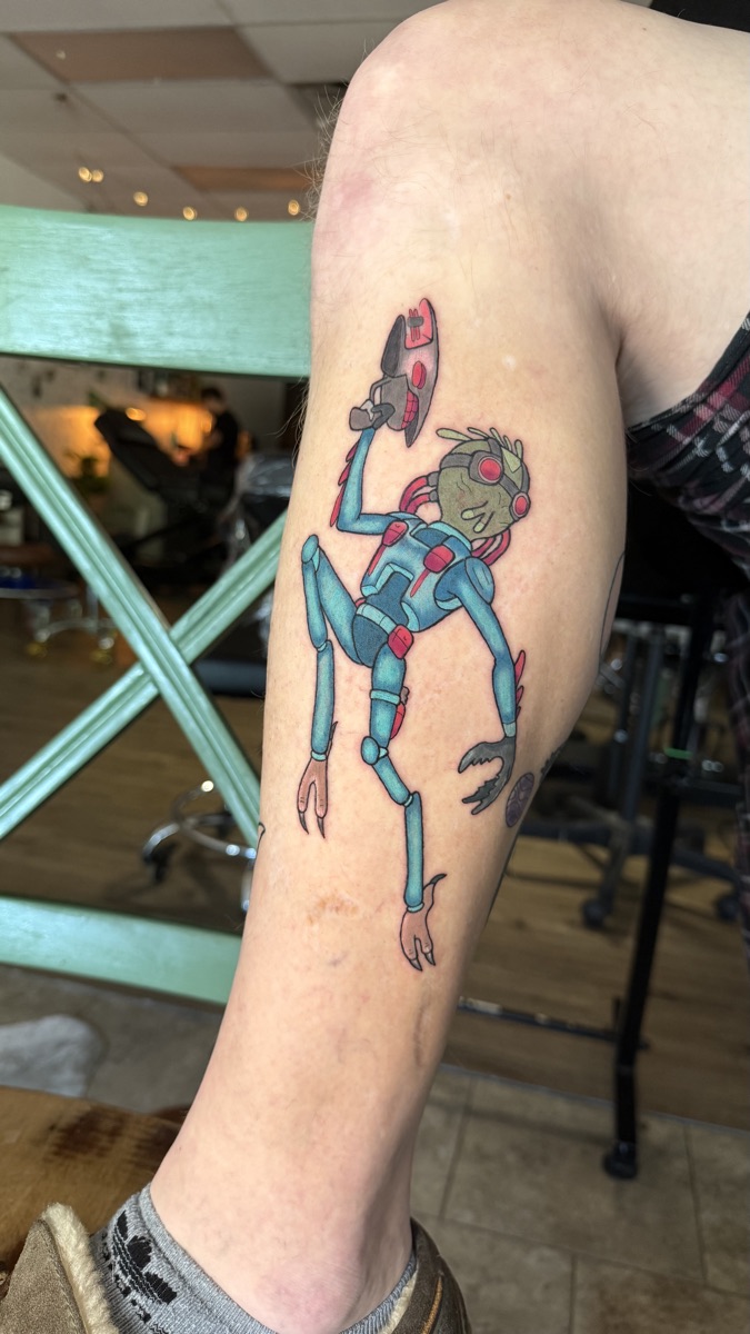 Colorful character tattoo by Cat Bernardy