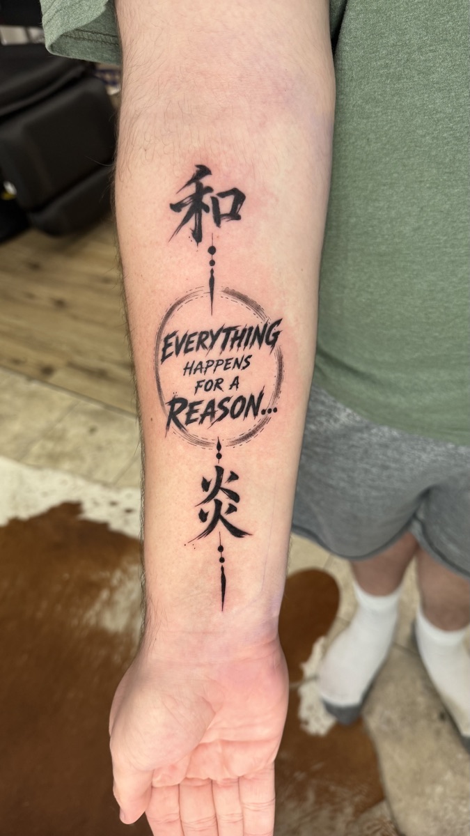 Kanji and script forearm tattoo by Cat Bernardy